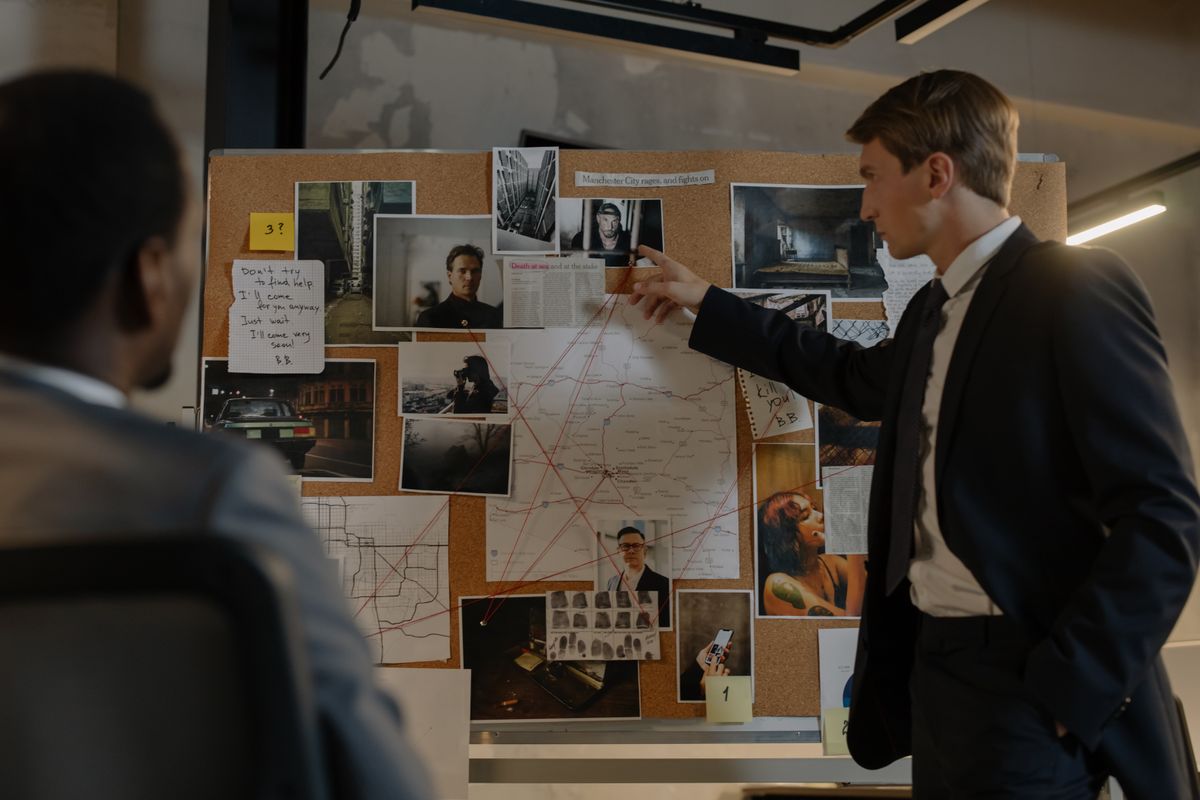 Investigators reviewing an evidence board